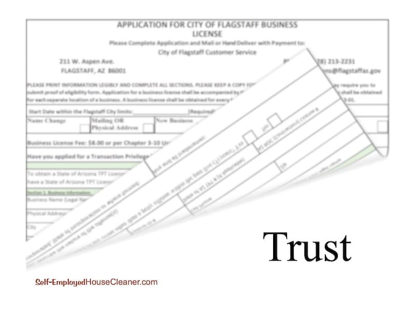 Business license application form with corner flipped to reveal the word Trust underneath. Get a license for your house cleaning business to increase customer trust.